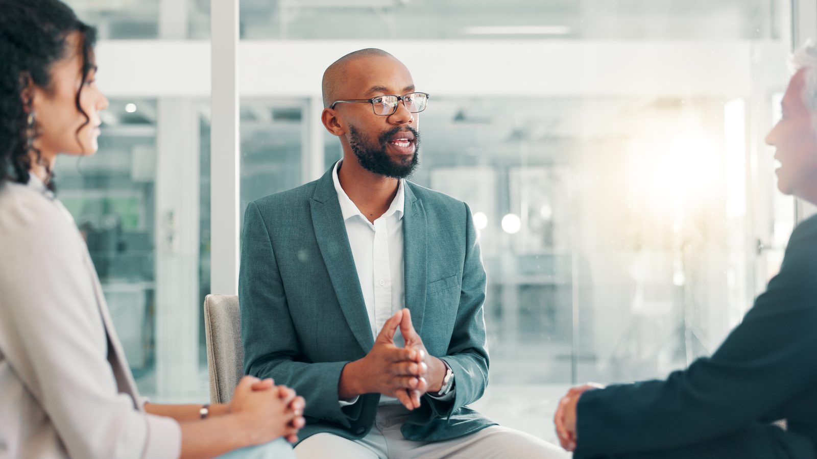 A leader in conversation with a team member during a coaching session